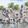 Outdoor Porous Stone Sculptures with Water Reflection and Green Trees in Garden Landscape