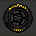 Goodyear Eagle Car Tire With Worn Appearance And Black Wheel Rim