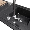 Modern Black Kitchen Sink with Faucet Cutting Board and Utensils on Countertop