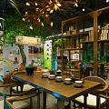 Traditional Tea Specialty Store Interior With Green Plants Chandeliers Wooden Tables And Tea Sets