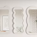 Three Different Shaped White Frame Mirrors with Reflections of Painting Plant and Grid Background