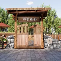 Wooden Entrance Gate With Stone Wall Surroundings Lush Green Trees Red Umbrellas And Wooden Tables