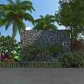 Natural Stone Feature Wall in Garden Landscape With Palm Trees and Colorful Plants