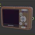 Nikon Electronic Digital Camera In Orange With LCD Screen And Control Buttons
