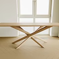 Minimalist Modern Light Wood Office Desk With Crossed Legs In Bright Room With Window