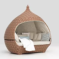 Rattan Woven Dome Shaped Hammock with Cushions and Light Colored Padding