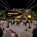 Tech Empowerment Ecosystem Event Banquet Hall Setup With Stage Round Tables And Green Plants