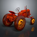 Vintage Red Tractor With Large Wheels And Yellow Rims On Gray Background