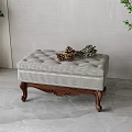 Checkered Upholstered Ottoman Bench With Wooden Carved Legs And Decorative Pinecones Greenery