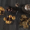 Assorted Foods Display With Oranges Chocolate Pieces Artisan Bread And Persimmons On Dark Wooden Table