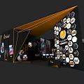 Modern Exhibition Booth with Black Yellow Design Hexagonal Elements Brand Logos and Display Screens
