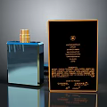 Woman Using Luxury Chanel Perfume With Blue Bottle And Black Gold Box