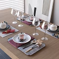Elegant Dinnerware Set with Plates Bowls Wine Glasses Placemats and Gold Cutlery on Wooden Table
