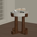 Modern Bedside Table With White Top Wooden Legs Open Book Cup And Glasses