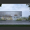 Modern Office Building Featuring Glass Curtain Wall Open Design Greenery Spacious Entrance And Passing Vehicle