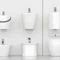 Modern White Bathroom Fixtures With Wall Mounted Toilets And Pedestal Sinks