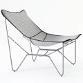 Beige Leather Leisure Chair With Curved Design And Black Metal Frame