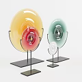 Colorful Decorative Discs On Black Stands With White Background Arrangement