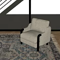Light Beige Single Sofa With Black Wooden Arms On Patterned Rug And Wooden Floor