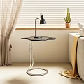 Modern Side Table With Transparent Stand Black Top Black Lamp And Cactus Plant Near Sofa