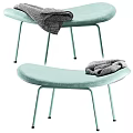 Light Green Padded Stool With Metal Legs And Gray Cloth Placed On Seat
