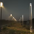 Various Design Outdoor Lights Illuminating Night Pathway With Grass And Distant Buildings