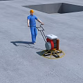 Construction Site Worker Operating Concrete Grinder to Smooth Floor Surface