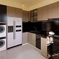 Modern Kitchen Interior With Dark Cabinets Black Countertop Appliances And Sunlight