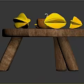 Wooden Round Table With Bright Yellow Origami Shapes And Small Decorative Candle