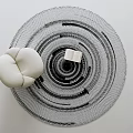 Black and White Round Rug With Concentric Circle Pattern White Round Cushion and Open Book