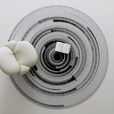 Black and White Round Rug With Concentric Circle Pattern White Round Cushion and Open Book 3d model