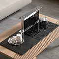 Modern Kitchen Appliances Featuring Built in Induction Cooktop With Kettle And Cups On Wooden Countertop