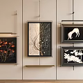 Stylish Framed Decorative Paintings With Various Designs Hanging On Beige Wall