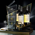 Elegant Wine Bottles And Glasses Display With Trophy On Black Background