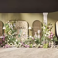 Beautiful Floral Installation With Green Background Wall Arched Doorways White Columns And Decorative Flowers