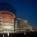 Modern Commercial Complex Night View With Glass Facade Unique Exterior And Lighting