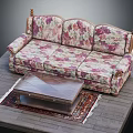 Three Seater Floral Print Upholstered Sofa With Wooden Coffee Table And Patterned Rug