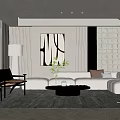 Modern Minimalist Living Room Features White Sectional Sofa Abstract Art And Black Round Coffee Table