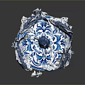 Blue and White Sculpture With Central Figure Surrounding Fish And Circular Patterned Base