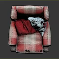 Plaid Upholstered Armchair With Red And Blue Pillows And Wooden Legs