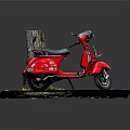 Red Scooter Parked Near Tree Stump With Fallen Leaves On Gray Pavement