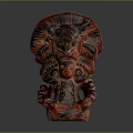 Traditional Red Deity Sculpture With Intricate Carvings And Detailed Headdress On Dark Background