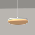 Modern Round Pendant Light With Beige Shade And Soft Warm Light Hanging In Interior