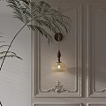 Classic Wooden Wall Lamp With Ribbed Glass Shade On Neutral Wall And Palm Leaves