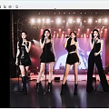 Women Performing on Stage with Microphones in Black Outfits and Stage Lights