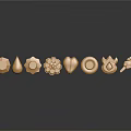 Golden Decorative Ornaments Featuring Various Geometric And Floral Shapes On Dark Surface