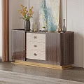 Elegant Dark Brown Storage Cabinet With Woven Drawer Panels Gold Base And Top Decorative Items