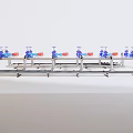 Industrial Equipment Featuring Stainless Steel Pipe System With Blue Valves And Red Labels