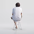 Man sitting on stool holding cup wearing white shirt shorts and sandals against white background