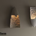 Textured Stone Wall Lamp With Warm Glow And Modern Artistic Design